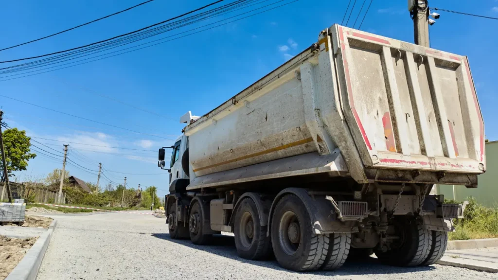 Dump trucks are often seen at construction sites and are used to haul debris, gravel, and sand. Their heavy loads and limited maneuverability make them prone to tipping over, causing accidents that can block multiple lanes of traffic.